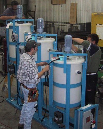 Three cascading agitated pilot plant tanks with immersion heaters configured for a pilot plant precipitation circuit.