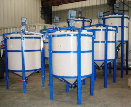 Leach tanks arranged for cascading flow.