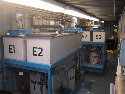 Portable solvent extraction pilot plant inside a shipping container.