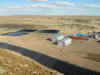 View of copper dump leaching showing SX / EW buildings and PLS ponds